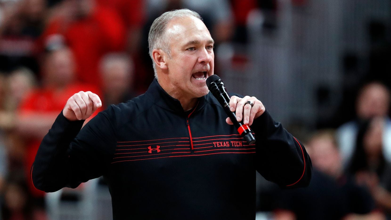 Texas Tech football coach Joey McGuire talks to the crowd during the halftime of an NCAA college basketball game against North Florida, Tuesday, Nov. 9, 2021, in Lubbock, Texas. (Brad Tollefson/Lubbock Avalanche-Journal via AP)