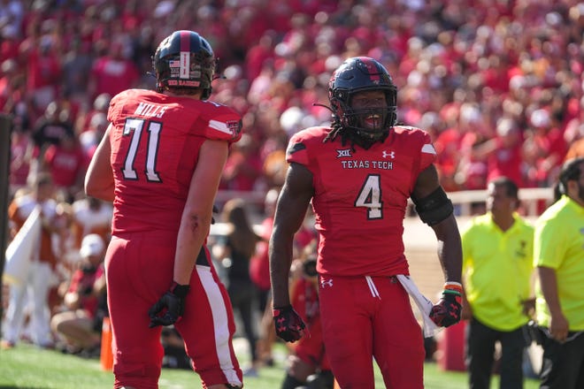Texas Tech running back SaRodorick Thompson celebrates a touchdown during Saturday's game. The Red Raiders snapped a four-game losing streak to the Longhorns, who also had won four straight games at Jones AT&T Stadium dating back to 2010.