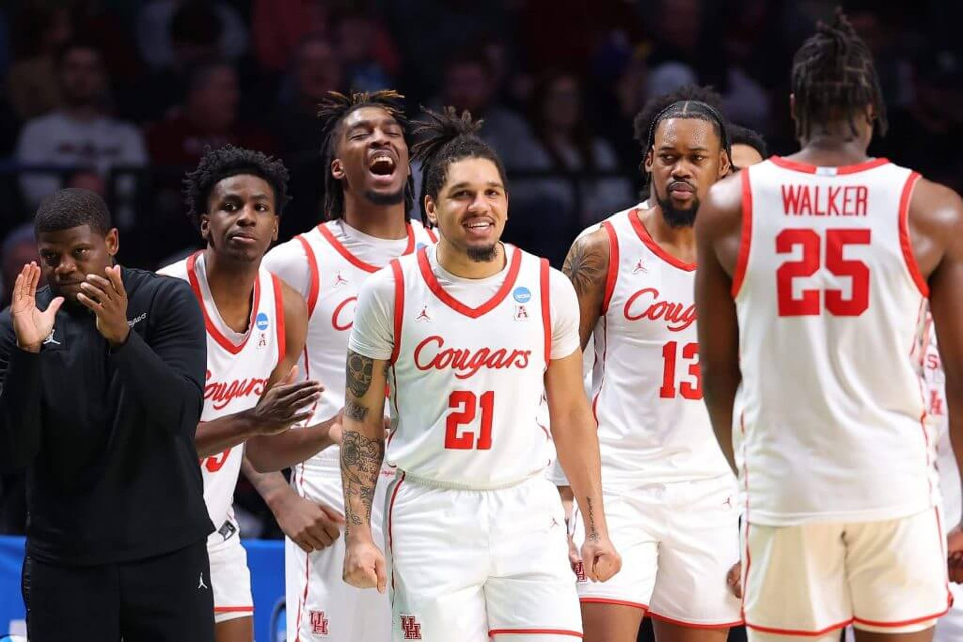 BIRMINGHAM, ALABAMA - MARCH 18: Emanuel Sharp #21 of the Houston Cougars and teammates celebrate as they defeat the Auburn Tigers 81-64 in the second round of the NCAA Men's Basketball Tournament at Legacy Arena at the BJCC on March 18, 2023 in Birmingham, Alabama. (Photo by Kevin C. Cox/Getty Images)