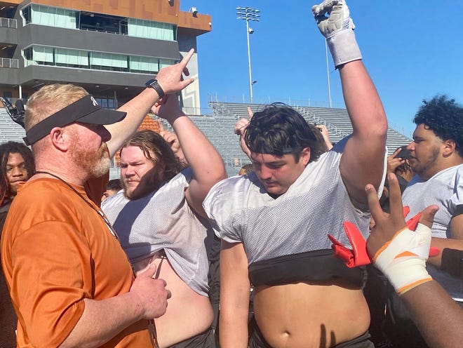 Hutto football coach Will Compton, leading his team during a practice break, said receiver Alex Green and quarterback Will Compton are self-motivated to do whatever it takes to succeed. The Hippos play Duncanville in a playoff game Friday.